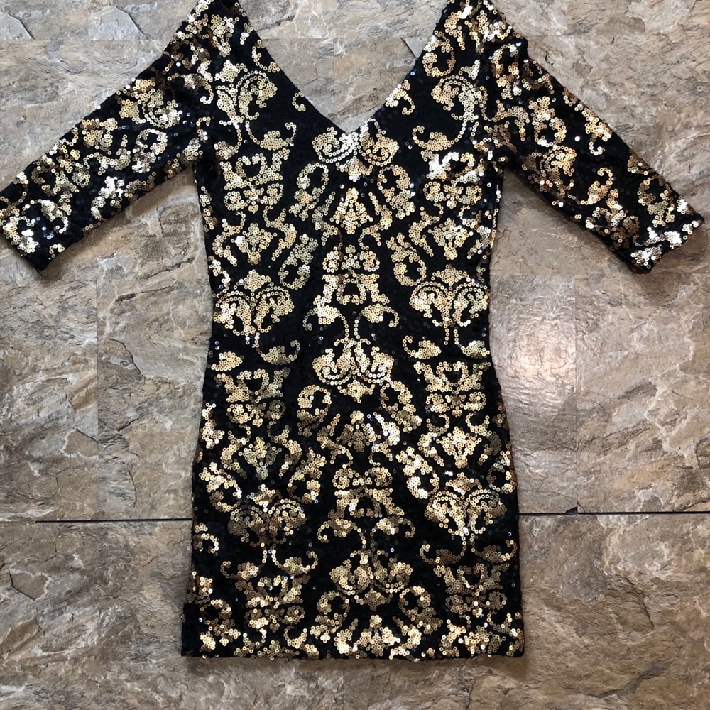 Black and gold sequin dress